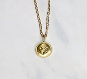 Gold plated dainty necklace with rose embossed detail. 